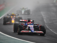 Liam Lawson of Visa Cash App RB F1 Team VCARB 01 and Sergio Perez of Red Bull Racing RB20 participate in the Formula 1 Grand Prix of Brazil...