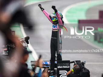 Esteban Ocon of the Alpine F1 Team celebrates his podium during the Formula 1 Grand Prix of Brazil at Autodromo Jose Carlos Pace in Sao Paul...