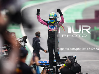 Esteban Ocon of the Alpine F1 Team celebrates his podium during the Formula 1 Grand Prix of Brazil at Autodromo Jose Carlos Pace in Sao Paul...