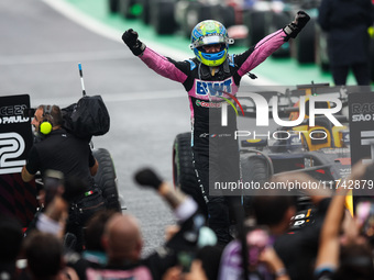 Esteban Ocon of the Alpine F1 Team celebrates his podium during the Formula 1 Grand Prix of Brazil at Autodromo Jose Carlos Pace in Sao Paul...