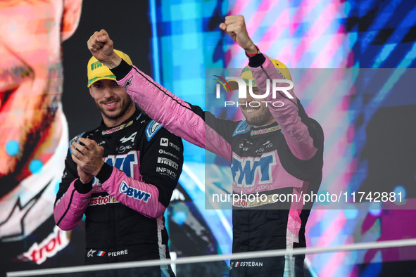 Esteban Ocon and Pierre Gasly of the Alpine F1 Team A524 celebrate their podium during the Formula 1 Grand Prix of Brazil at Autodromo Jose...