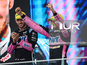 Esteban Ocon and Pierre Gasly of the Alpine F1 Team A524 celebrate their podium during the Formula 1 Grand Prix of Brazil at Autodromo Jose...