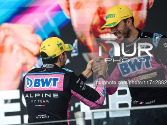 Esteban Ocon and Pierre Gasly of the Alpine F1 Team A524 celebrate their podium during the Formula 1 Grand Prix of Brazil at Autodromo Jose...