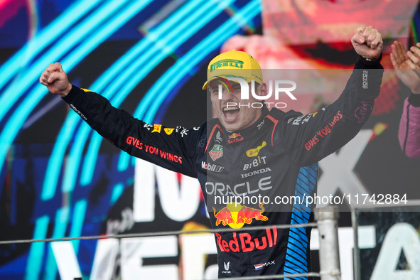 Max Verstappen of Red Bull Racing RB20 celebrates his victory on the podium during the Formula 1 Grand Prix of Brazil at Autodromo Jose Carl...