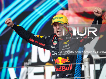 Max Verstappen of Red Bull Racing RB20 celebrates his victory on the podium during the Formula 1 Grand Prix of Brazil at Autodromo Jose Carl...