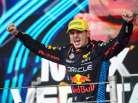 Max Verstappen of Red Bull Racing RB20 celebrates his victory on the podium during the Formula 1 Grand Prix of Brazil at Autodromo Jose Carl...