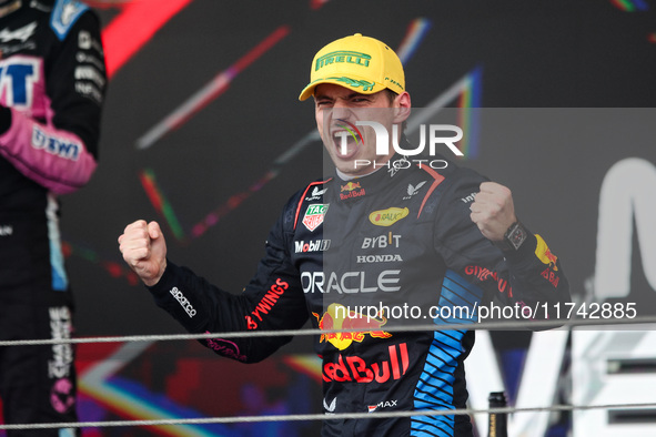 Max Verstappen of Red Bull Racing RB20 celebrates his victory on the podium during the Formula 1 Grand Prix of Brazil at Autodromo Jose Carl...