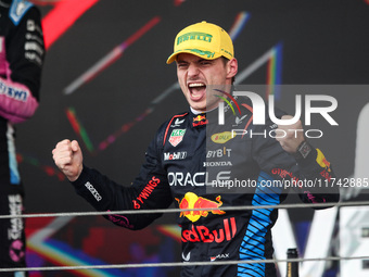 Max Verstappen of Red Bull Racing RB20 celebrates his victory on the podium during the Formula 1 Grand Prix of Brazil at Autodromo Jose Carl...