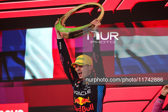 Max Verstappen of Red Bull Racing RB20 celebrates his victory on the podium during the Formula 1 Grand Prix of Brazil at Autodromo Jose Carl...