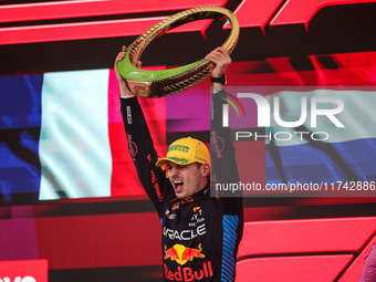 Max Verstappen of Red Bull Racing RB20 celebrates his victory on the podium during the Formula 1 Grand Prix of Brazil at Autodromo Jose Carl...