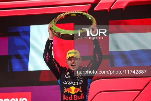 Max Verstappen of Red Bull Racing RB20 celebrates his victory on the podium during the Formula 1 Grand Prix of Brazil at Autodromo Jose Carl...