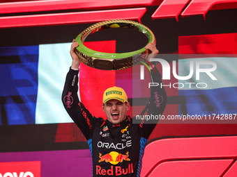 Max Verstappen of Red Bull Racing RB20 celebrates his victory on the podium during the Formula 1 Grand Prix of Brazil at Autodromo Jose Carl...