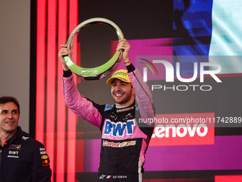 Esteban Ocon of the Alpine F1 Team A524 celebrates his podium during the Formula 1 Grand Prix of Brazil at Autodromo Jose Carlos Pace in Sao...