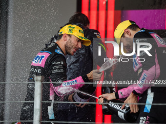 Esteban Ocon and Pierre Gasly of the Alpine F1 Team A524 celebrate their podium during the Formula 1 Grand Prix of Brazil at Autodromo Jose...