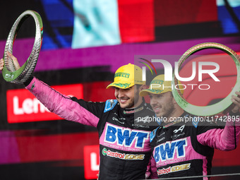 Esteban Ocon and Pierre Gasly of the Alpine F1 Team A524 celebrate their podium during the Formula 1 Grand Prix of Brazil at Autodromo Jose...