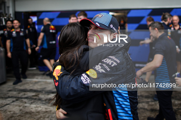 Max Verstappen of Red Bull Racing RB20 celebrates the victory with Kelly Piquet during the Formula 1 Grand Prix of Brazil at Autodromo Jose...