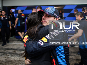 Max Verstappen of Red Bull Racing RB20 celebrates the victory with Kelly Piquet during the Formula 1 Grand Prix of Brazil at Autodromo Jose...