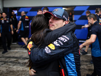 Max Verstappen of Red Bull Racing RB20 celebrates the victory with Kelly Piquet during the Formula 1 Grand Prix of Brazil at Autodromo Jose...