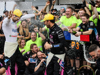 Pierre Gasly and Esteban Ocon of the Alpine F1 Team celebrate the podium with the team during the Formula 1 Grand Prix of Brazil at Autodrom...