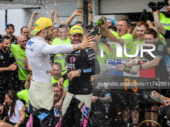 Pierre Gasly and Esteban Ocon of the Alpine F1 Team celebrate the podium with the team during the Formula 1 Grand Prix of Brazil at Autodrom...