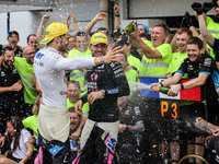 Pierre Gasly and Esteban Ocon of the Alpine F1 Team celebrate the podium with the team during the Formula 1 Grand Prix of Brazil at Autodrom...