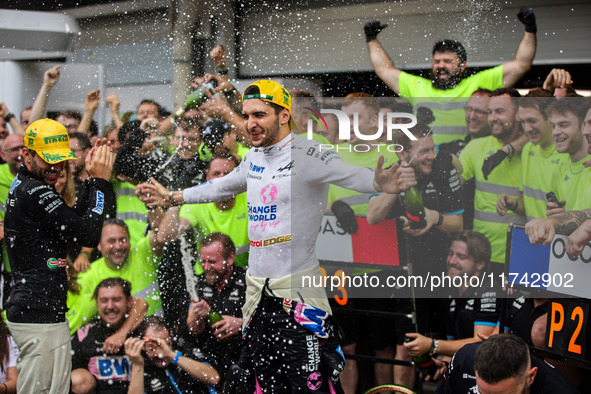 Pierre Gasly and Esteban Ocon of the Alpine F1 Team celebrate the podium with the team during the Formula 1 Grand Prix of Brazil at Autodrom...