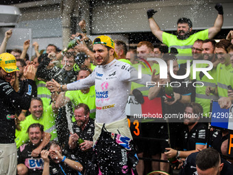 Pierre Gasly and Esteban Ocon of the Alpine F1 Team celebrate the podium with the team during the Formula 1 Grand Prix of Brazil at Autodrom...