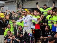 Pierre Gasly and Esteban Ocon of the Alpine F1 Team celebrate the podium with the team during the Formula 1 Grand Prix of Brazil at Autodrom...