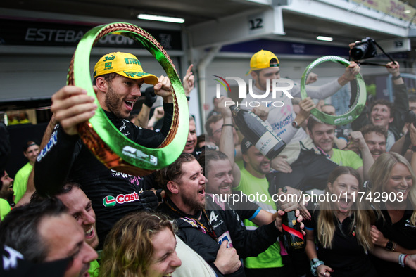 Pierre Gasly and Esteban Ocon of the Alpine F1 Team celebrate the podium with the team during the Formula 1 Grand Prix of Brazil at Autodrom...