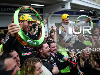 Pierre Gasly and Esteban Ocon of the Alpine F1 Team celebrate the podium with the team during the Formula 1 Grand Prix of Brazil at Autodrom...