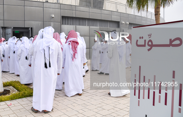 Qatari men arrive at a polling station in Doha, Qatar, on November 5, 2024, to cast their votes in a general referendum on constitutional am...