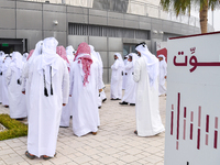 Qatari men arrive at a polling station in Doha, Qatar, on November 5, 2024, to cast their votes in a general referendum on constitutional am...