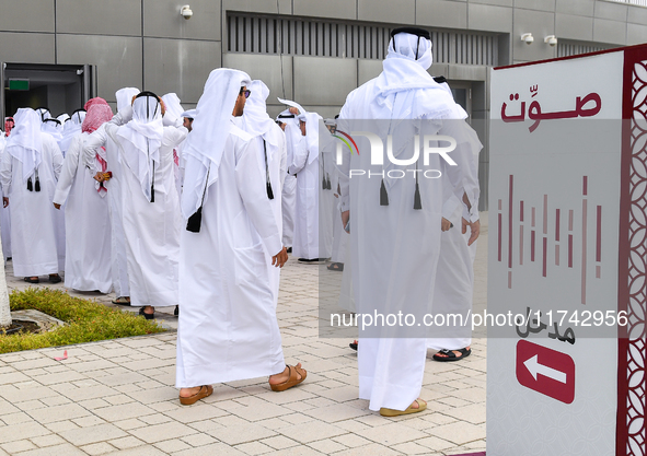 Qatari men arrive at a polling station in Doha, Qatar, on November 5, 2024, to cast their votes in a general referendum on constitutional am...