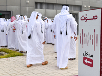 Qatari men arrive at a polling station in Doha, Qatar, on November 5, 2024, to cast their votes in a general referendum on constitutional am...