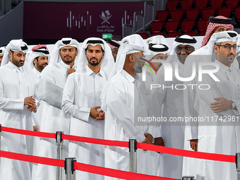 Qatari men wait in long queues to vote at a polling station in Doha, Qatar, on November 5, 2024, to cast their votes in a general referendum...