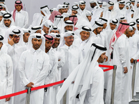 Qatari men wait in long queues to vote at a polling station in Doha, Qatar, on November 5, 2024, to cast their votes in a general referendum...