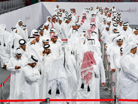 Qatari men wait in long queues to vote at a polling station in Doha, Qatar, on November 5, 2024, to cast their votes in a general referendum...