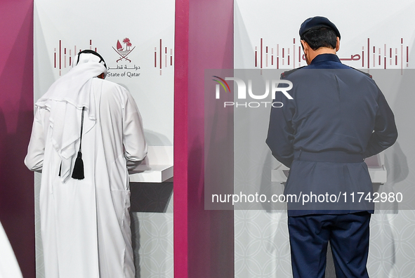 Qatari men cast their votes at a polling station in Doha, Qatar, on November 5, 2024, in a general referendum on constitutional amendments,...