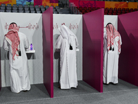 Qatari men cast their votes at a polling station in Doha, Qatar, on November 5, 2024, in a general referendum on constitutional amendments,...