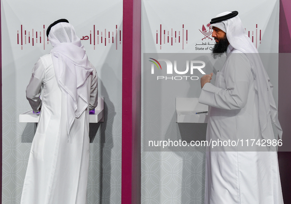 Qatari men cast their votes at a polling station in Doha, Qatar, on November 5, 2024, in a general referendum on constitutional amendments,...