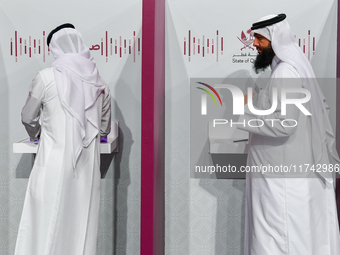 Qatari men cast their votes at a polling station in Doha, Qatar, on November 5, 2024, in a general referendum on constitutional amendments,...