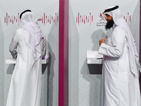 Qatari men cast their votes at a polling station in Doha, Qatar, on November 5, 2024, in a general referendum on constitutional amendments,...