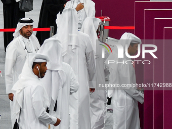 Qatari men cast their votes at a polling station in Doha, Qatar, on November 5, 2024, in a general referendum on constitutional amendments,...