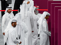 Qatari men cast their votes at a polling station in Doha, Qatar, on November 5, 2024, in a general referendum on constitutional amendments,...