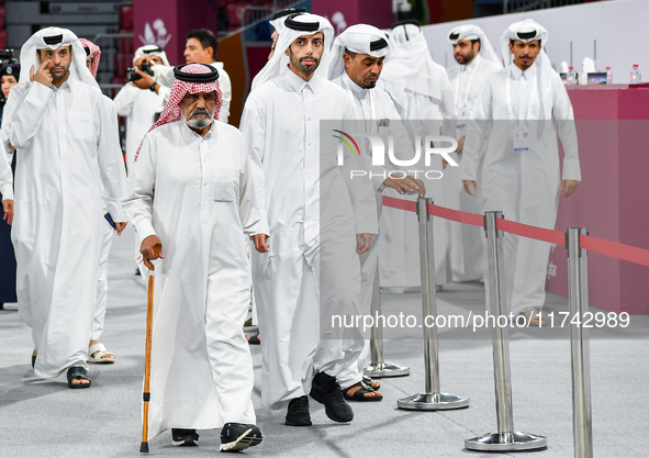 Qatari men arrive at a polling station in Doha, Qatar, on November 5, 2024, to cast their votes in a general referendum on constitutional am...