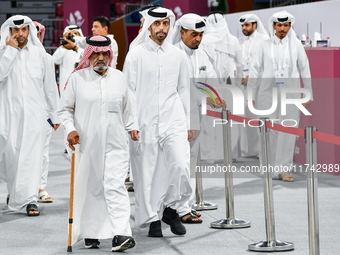 Qatari men arrive at a polling station in Doha, Qatar, on November 5, 2024, to cast their votes in a general referendum on constitutional am...