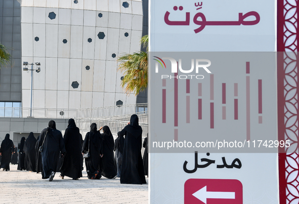 Qatari women arrive at a polling station in Doha, Qatar, on November 5, 2024, to cast their votes in a general referendum on constitutional...