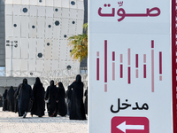 Qatari women arrive at a polling station in Doha, Qatar, on November 5, 2024, to cast their votes in a general referendum on constitutional...