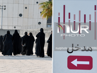 Qatari women arrive at a polling station in Doha, Qatar, on November 5, 2024, to cast their votes in a general referendum on constitutional...