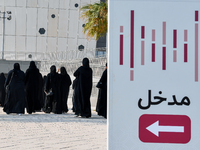 Qatari women arrive at a polling station in Doha, Qatar, on November 5, 2024, to cast their votes in a general referendum on constitutional...